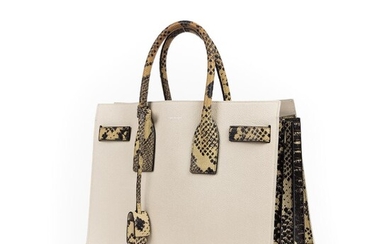 SOLD. Yves Saint Laurent: "Sac de Jour" A bag of white leather and snakeskin embossed leather with silver tone hardware. – Bruun Rasmussen Auctioneers of Fine Art