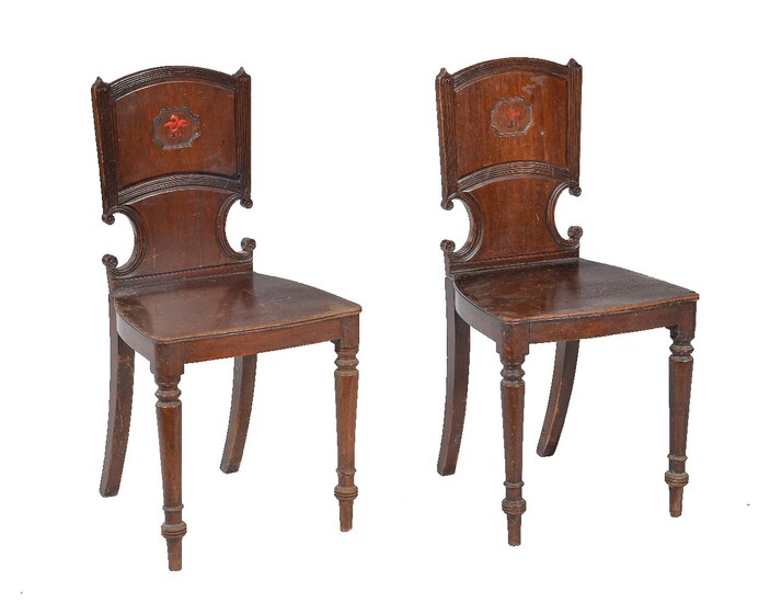 A pair of Regency mahogany hall chairs