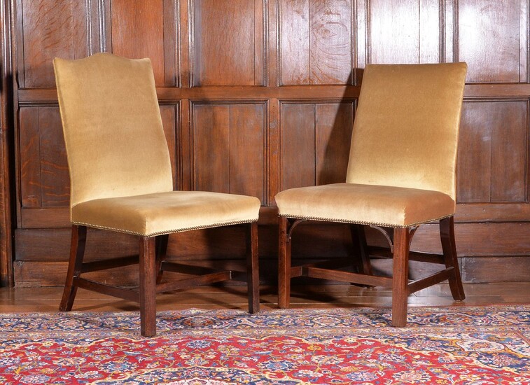 Two similar George III mahogany chairs