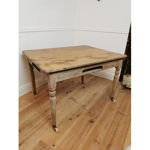 19th C. stripped pine bakers table on turned legs and brass ...