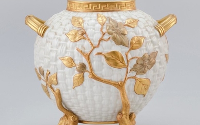 ROYAL WORCESTER IVORY WARE VASE In the form of an ovoid basket with relief branch and flower design and four tree branch-form feet....