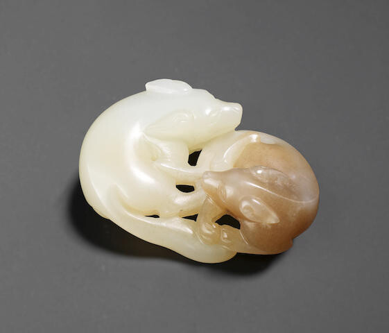A white and brown jade 'double badger' carving