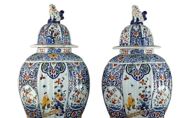 A PAIR OF DUTCH DELFT POLYCHROME OCTAGONAL VASES AND COVERS, 19TH CENTURY