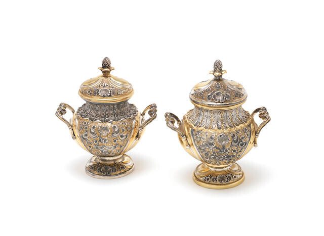 A matched pair of Italian metalware and gilded pots and covers