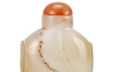 CHINESE CHALCEDONY AGATE SNUFF BOTTLE In flattened ovoid form, with mask handles. Height 2.75". Carnelian stopper.