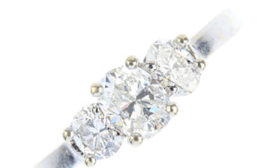 A diamond three-stone ring. View more details