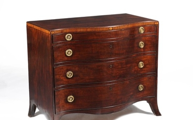 A George III mahogany and inlaid serpentine fronted chest of drawers