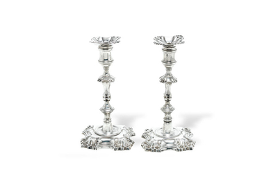 A matched pair of silver candlesticks
