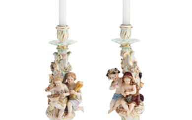 A pair of Meissen candlesticks