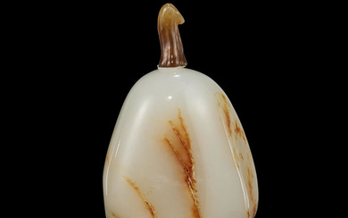 A white and russet jade pebble-form snuff bottle