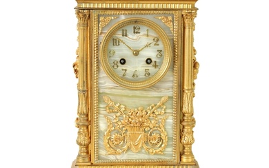 A 19TH CENTURY FRENCH ORMOLU AND ONYX PANELLED MANTEL CLOCK ...