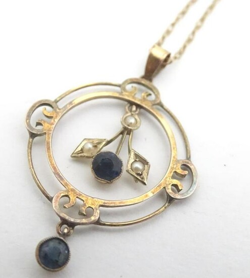 A 9ct gold pendant and chain, the pendant set with blue
