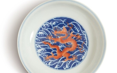 A BLUE AND WHITE AND IRON-RED 'DRAGON' DISH, QIANLONG SEAL MARK AND PERIOD