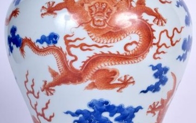 A CHINESE BLUE AND WHITE BALUSTER VASE bearing Qianlong