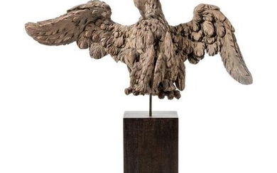A Carved Wood Model of a Spread-Winged Eagle on an