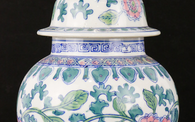 A Chinese ceramic lidded jar with floral decoration