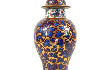 A Chinese 'clobbered' porcelain vase and cover, 19th century.