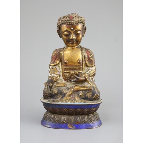 A Chinese copper alloy and enamel seated figure of Buddha Sh...