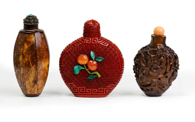 A Chinese hardstone inlaid cinnabar lacquer snuff bottle and two coconut snuff...