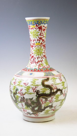 A Chinese porcelain bottle vase, kangxi mark, decorated in W...