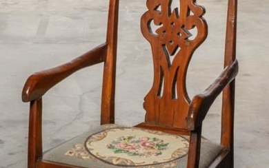 A Continental Baroque mixed wood armchair
