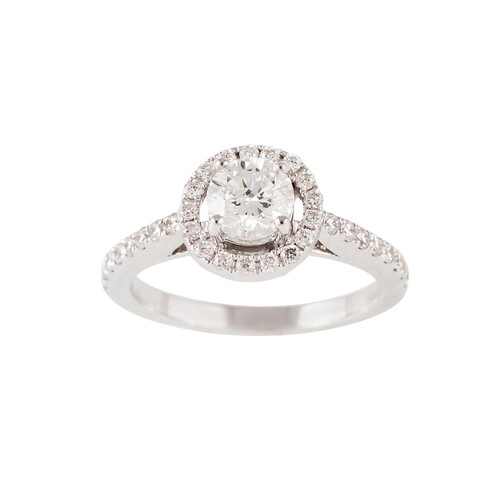 A DIAMOND CLUSTER RING, the brilliant cut diamond to diamond...