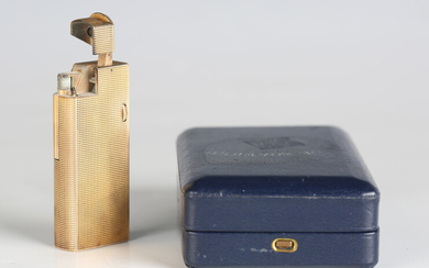 A Dunhill Paris silver gilt rectangular gas lighter, length 6.4cm, with a case.