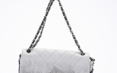 A FLAP BAG BY CHANEL