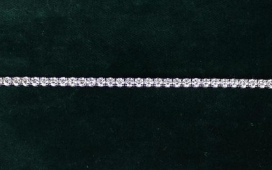 A Fine Diamond Bracelet composed of a chain of 51 round brilliant cut stones, total weight 7.6 carat