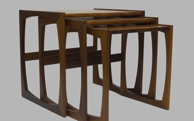 A G Plan Nest of tables, c.1960, with three graduated tables, largest 48.5cm high, 53cm wide, 43cm deep, together with a G plan 'Fresco' coffee table, 43cm high, 137cm wide, 51cm deep (2)