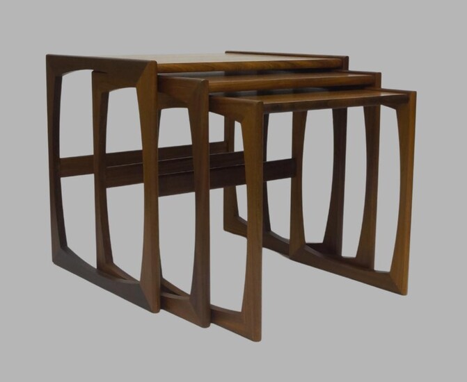 A G Plan Nest of tables, c.1960, with three graduated tables, largest 48.5cm high, 53cm wide, 43cm deep, together with a G plan 'Fresco' coffee table, 43cm high, 137cm wide, 51cm deep (2)