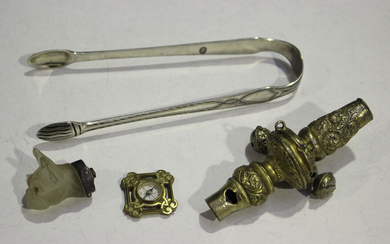 A George IV silver gilt child's rattle with whistle terminal, embossed with foliate scrolls and