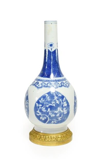 A Gilt Metal Mounted Chinese Porcelain Bottle Vase, the porcelain Kangxi, painted in underglaze...