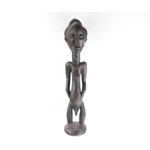 A Hemba standing male ancestor figure, (Singiti), Democratic...
