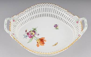 A K.P.M. Berlin porcelain basket having pierced sides and a pair of crabstock handles, Length: 12 in. (30.48 cm.)