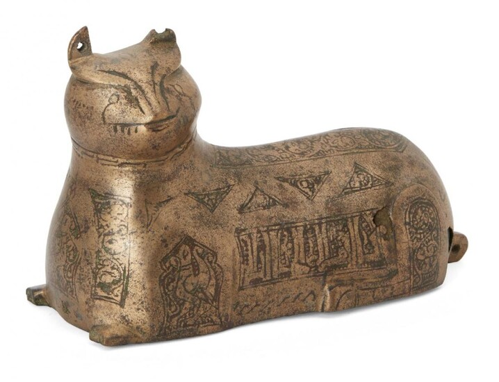 A Khorasan bronze weight in the form of a lion,...