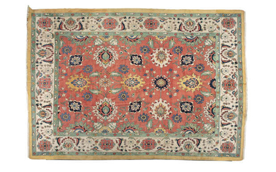 A LARGE CAUCASIAN WOOL CARPET, the rectangular central...