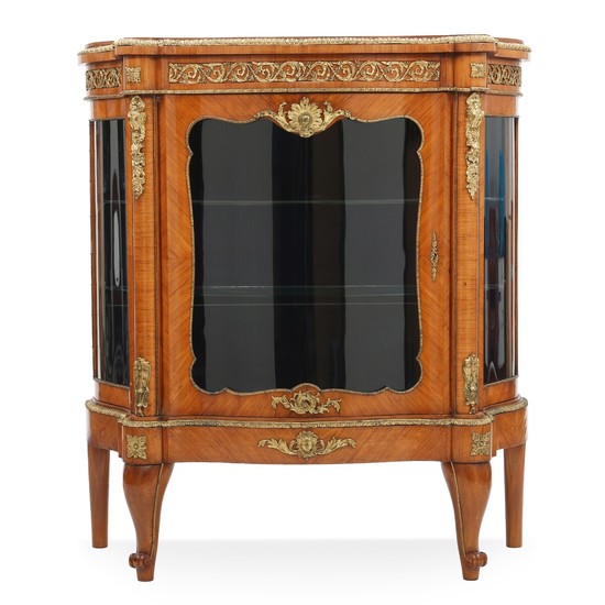 A Napoleon III fruitwood (?) display cabinet with gilt-bronze mountings and ornaments. Two glass shelves. France, ca. 1870. H. 135 cm. W. 122 cm. D. 47 cm.