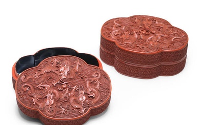 A PAIR OF CINNABAR LACQUER CARVED QUATRELOBED 'DRAGON' BOXES AND COVERS