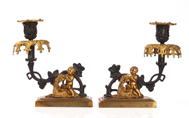 A PAIR OF EARLY VICTORIAN PARCEL-GILT AND BRONZE PATINATED CANDLESTICKS