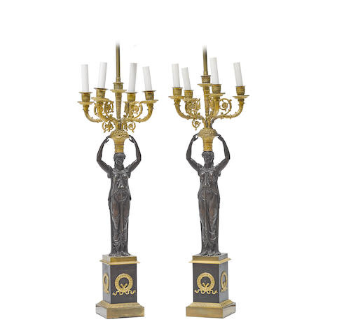 A PAIR OF EMPIRE GILT AND PATINATED BRONZE FIGURAL FIVE-LIGHT CANDELABRA