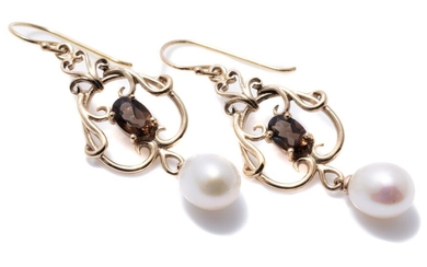 A PAIR OF NOUVEAU STYLE GEMSET EARRINGS; 9ct gold scrolling frames 14.7mm wide each centring an oval cut smoky quartz suspending a 7...
