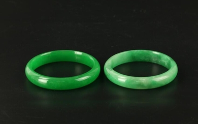 A Pair of Green Jadeite Bangle Bracelets