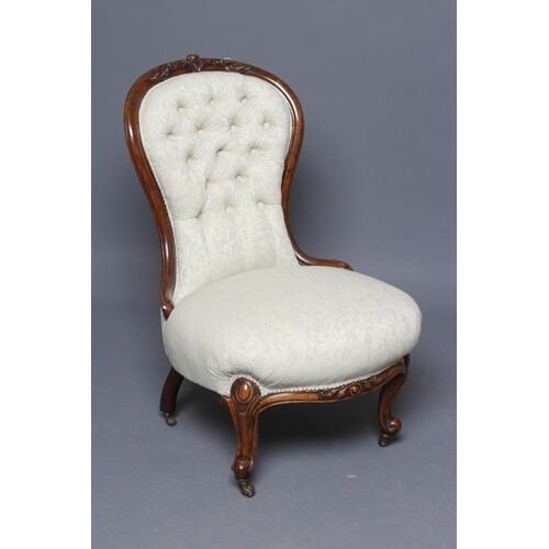 A VICTORIAN WALNUT SALON CHAIR of spoonback form button upho...