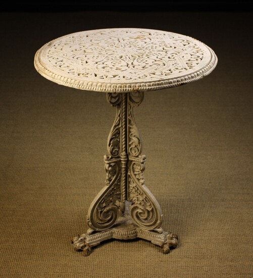 A Victorian Coalbrookdale Cast Iron Table designed by Christopher Dresser. The decoratively pierced circular top...
