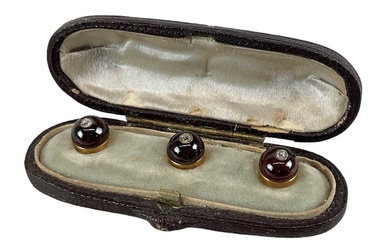 A Victorian cased set of three garnet and diamond set...