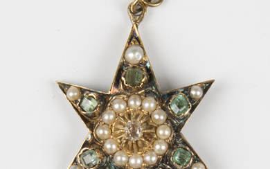 A Victorian diamond, emerald and half-pearl set pendant, designed as a six pointed starburst, mounte