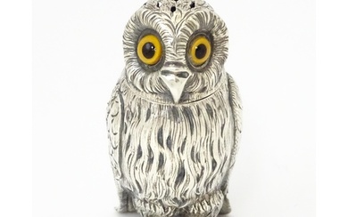 A Victorian silver novelty pepperette modelled as an owl wit...