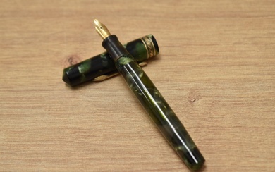 A Wahl Eversharp Doric One Shot vacuum fill fountain pen in green and black marble having