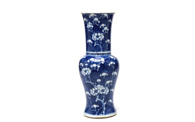 A blue and white porcelain cut-mouth vase painted with plum blossom on a blue ground